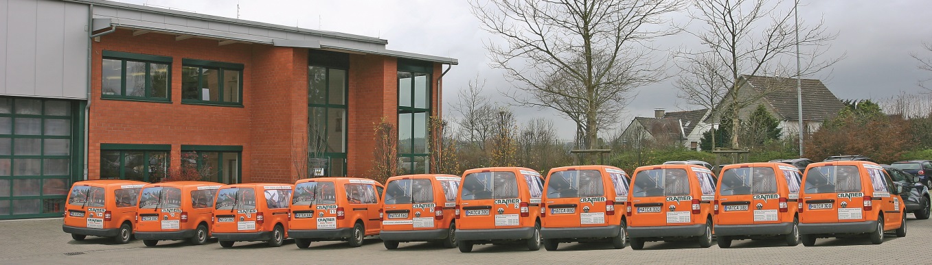 Cramer Caddy voor het gebouw